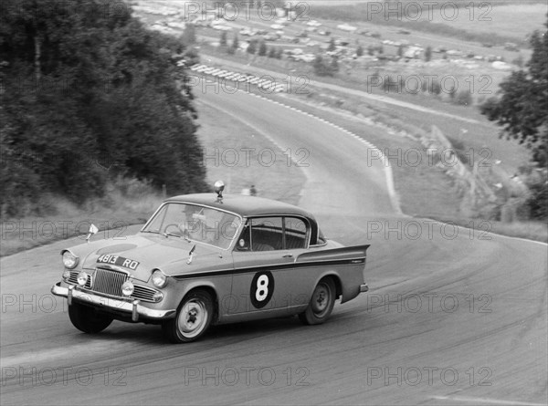 Sunbeam Rapier racing at Brands Hatch, Kent, 1961. Artist: Unknown