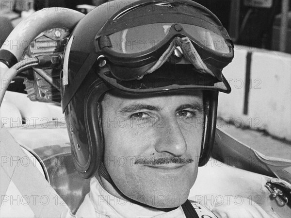 Graham Hill in cockpit of Lola T90, Indianapolis, 1966. Artist: Unknown