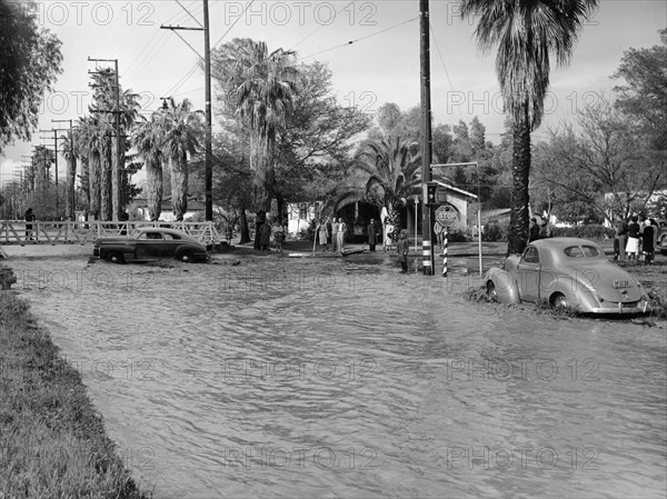 A Pontiac and a Willy's in a flood, USA, c1941. Artist: Unknown