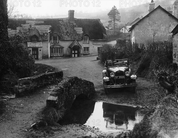 Kitty Brunell at the wheel of a Ford Model A, Winsford, Somerset, 1930. Artist: Unknown