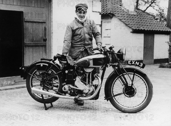 Donald Campbell outside a garage at Headley Grove, Surrey, 1938. Artist: Unknown