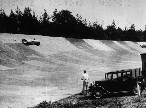 John Cobb's Napier Railton on the banking, Brooklands, Surrey, c1933-c1935. Artist: Unknown