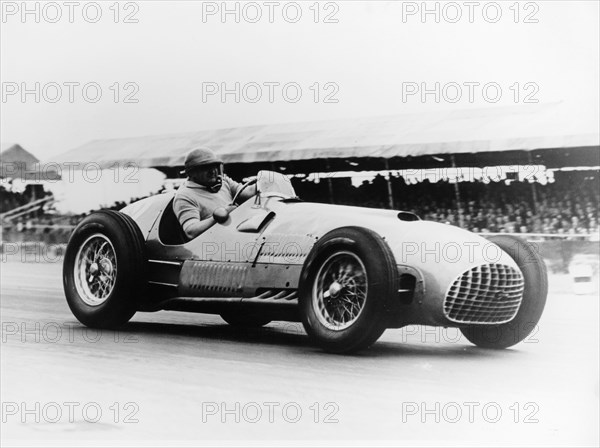 Froilan Gonzalez driving a Ferrari, early 1950s. Artist: Unknown