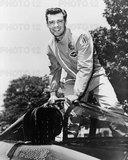 Craig Breedlove posing on top of the Spirit of America. Artist: Unknown