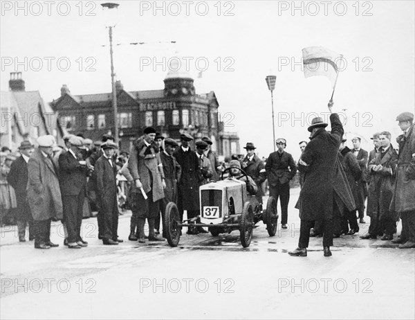 Archie Frazer-Nash waiting at the start of a motor racing event. Artist: Unknown