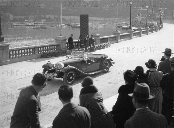 SH Light driving an SS1, at the Monte Carlo Rally, 1934. Artist: Unknown