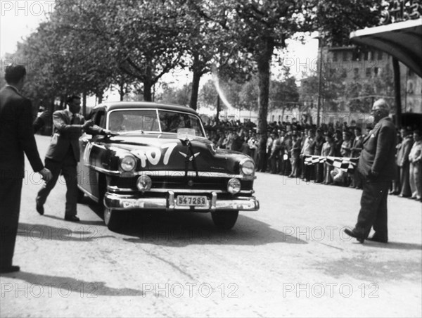 Paul Frere in a Chrysler Saloon V8, in the Mille Miglia, 1953. Artist: Unknown