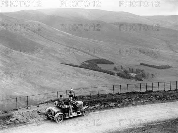 People with a Morris Cowley at the Devil's Beef Tub, Scotland, (c1930s?). Artist: Unknown