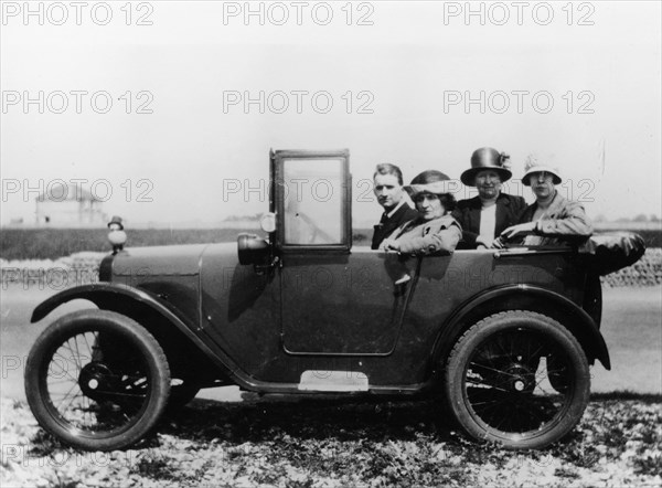 An Austin Seven Chummy with passengers, 1925. Artist: Unknown