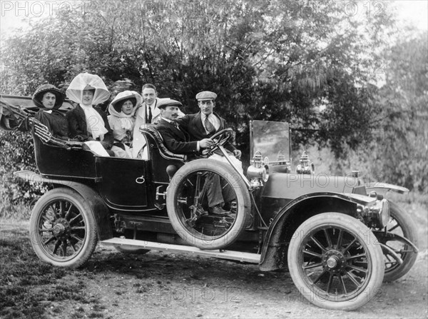 A group of men and women taking an outing in a 1907 Mercedes, 1908. Artist: Unknown