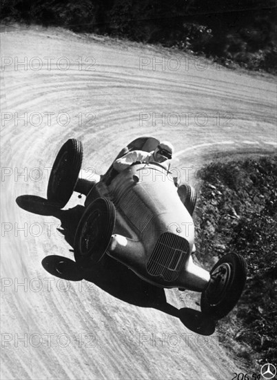 Manfred von Brauchitsch driving Mercedes-Benz W25 Grand Prix car, 1934. Artist: Unknown