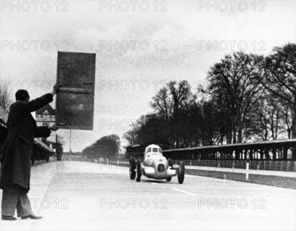 Rudolf Caracciola driving Mercedes-Benz W25 Streamliner car, 1934. Artist: Unknown