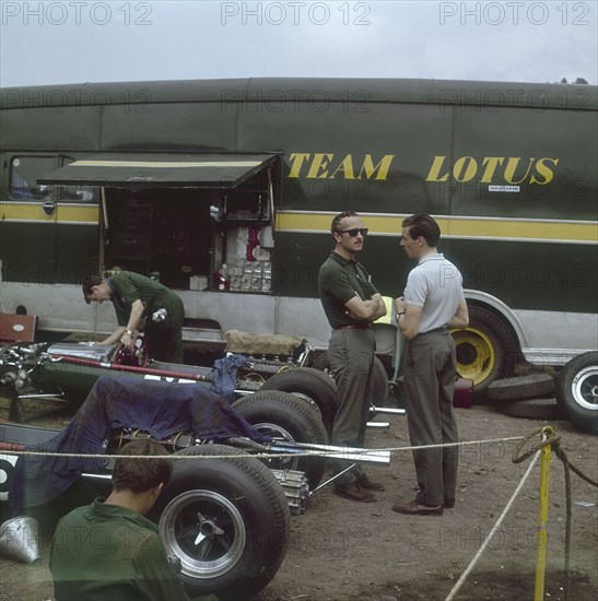 Chapman and Clark outside the Lotus team bus, French Grand Prix, Clermont-Ferrand, France, 1965. Artist: Unknown