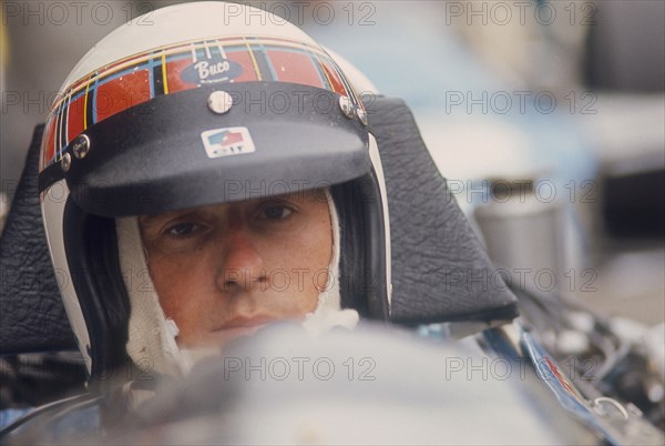 Jackie Stewart at the wheel of a racing car. Artist: Unknown