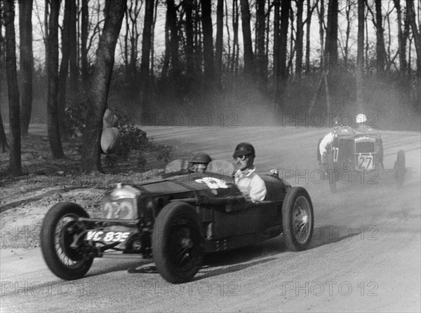 Riley leading a Fraser-Nash through Coppice Corner, Donington Park, Leicestershire, (c1930s?). Artist: Unknown