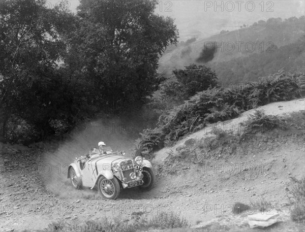 A Singer Nine taking part in the Barnstaple Trial, Barnstaple, Devon, 1935. Artist: Unknown