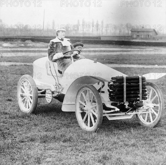 Madame du Gaste at the wheel of a De Dietrich, (c1910?). Artist: Unknown