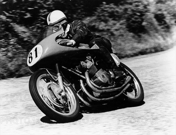 John Surtees on an MV Agusta, Isle of Man Senior TT, 1956. Artist: Unknown