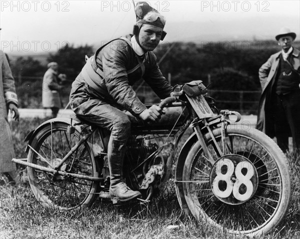 A man dressed in leathers on a Harley-Davidson. Artist: Unknown