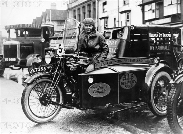 Woman riding a 1929 500cc AJS motorbike, (c1929?). Artist: Unknown