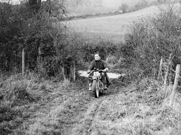 Syke riding an Ariel 4 during the Inter Varsity motor cross hill climb, November 1931. Artist: Unknown