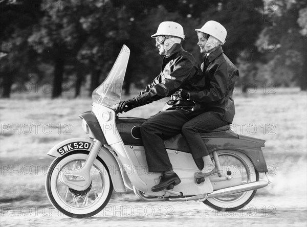 A man and a woman riding an Ariel Leader, 1958. Artist: Unknown