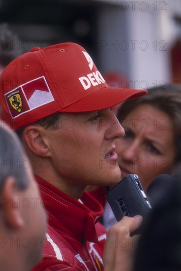 Michael Schumacher being interviewed, British Grand Prix, Silverstone, Northamptonshire, 1997. Artist: Unknown