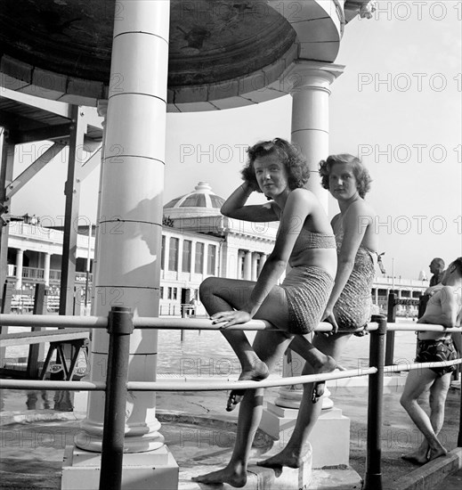 Two bathing beauties pose for the camera in the Blackpool Lido, c1946-c1955