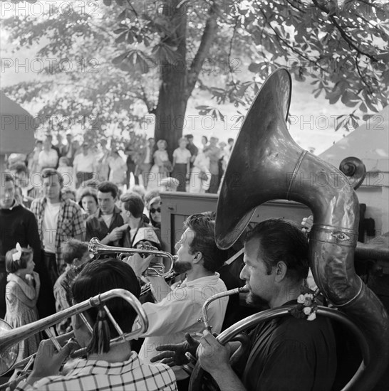 The brass section of a group of musicians, Hampstead Heath, London, c1946-c1959