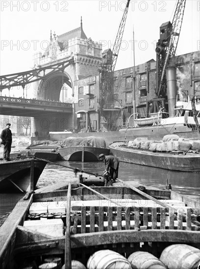 Lighters approaching the General Steam Navigation Company's wharf by Tower Bridge, London, c1905. Artist: Unknown