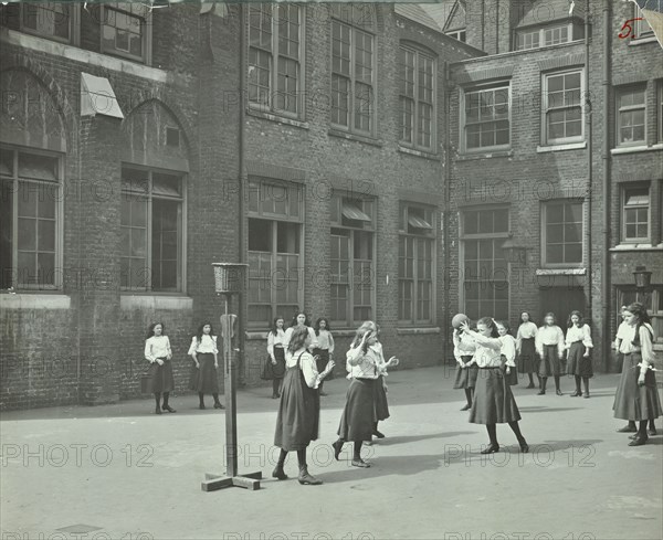 Girls playing netball in the playground, William Street Girls School, London, 1908. Artist: Unknown.