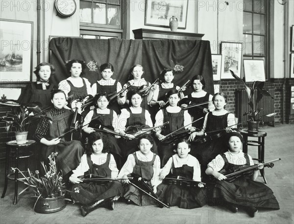 Girls swimming championship team with their shield, Tollington Park Central School, London, 1915. Artist: Unknown.