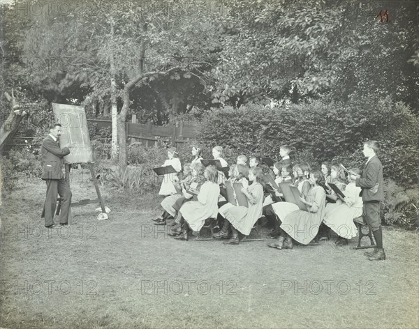 Arithmetic lesson in the garden, Birley House Open Air School, London, 1908. Artist: Unknown.