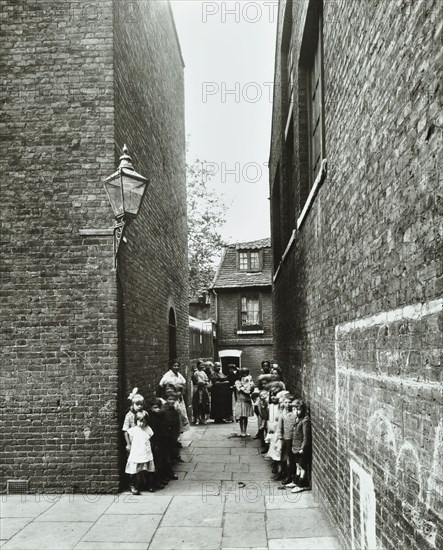 Children in an alleyway, Upper Ground Place, Southwark, London, 1923. Artist: Unknown.