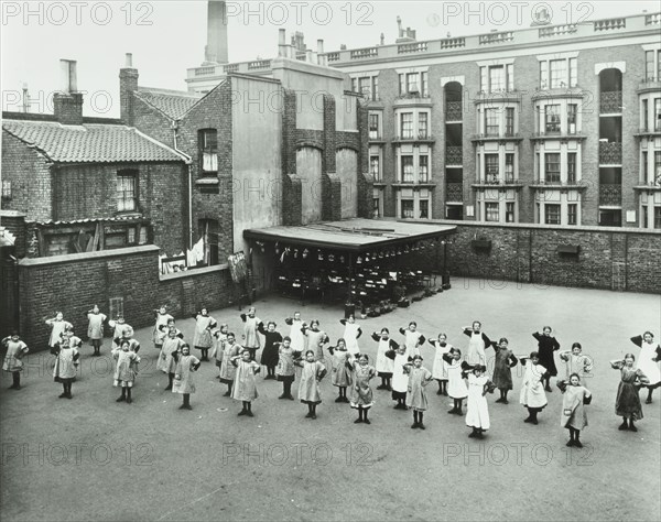 Open air exercise class, Ben Jonson School, Stepney, London, 1911. Artist: Unknown.