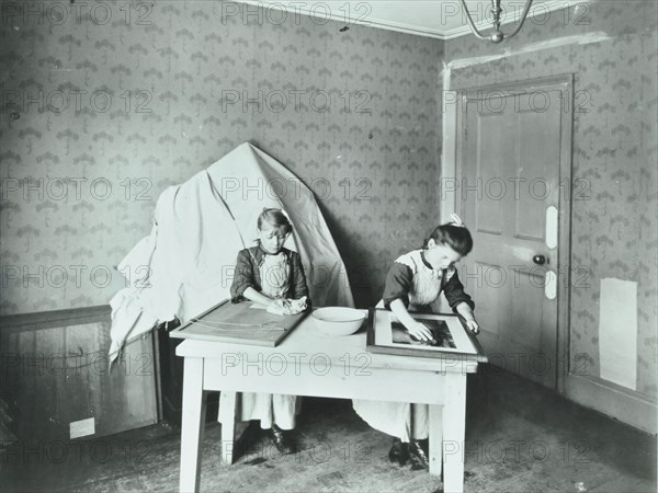 Spring cleaning; housewifery lesson, Denmark Hill School, Dulwich, London, 1908. Artist: Unknown.