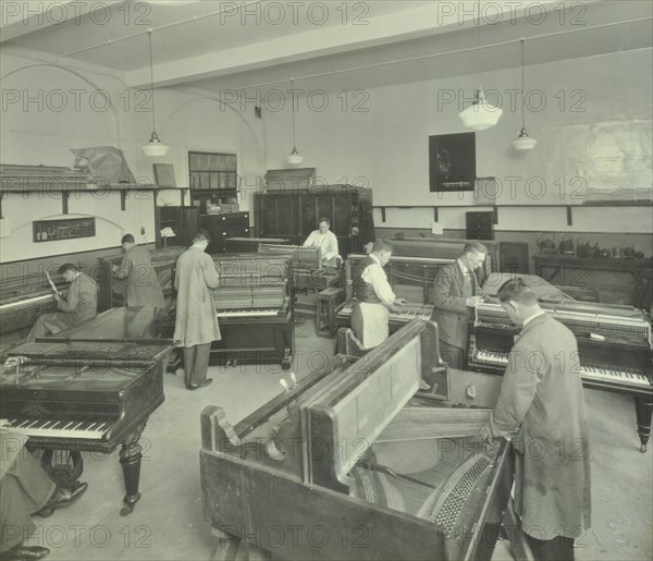 Piano repairing class, Northern Polytechnic, London, 1930. Artist: Unknown.