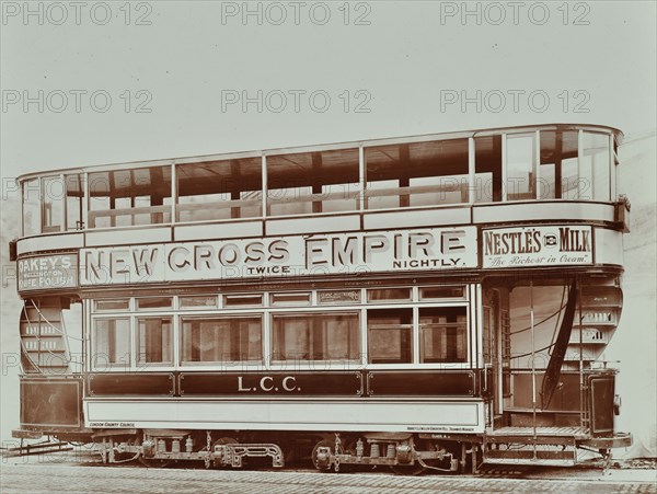 Double-decker electric tram with advertisement for the New Cross Empire, 1907. Artist: Unknown.