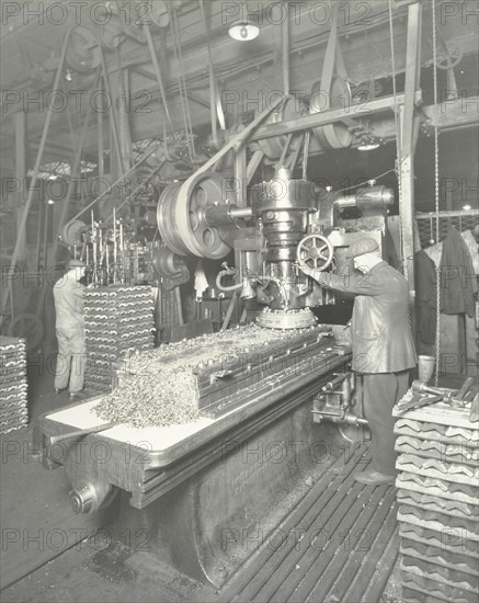 Man using a miller and planer, Charlton Central Repair Depot, London, 1932. Artist: Unknown.