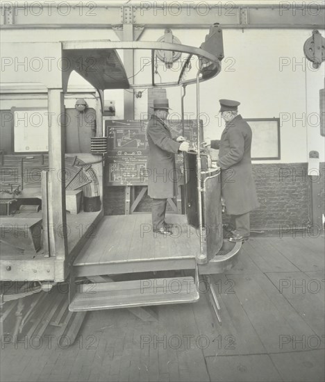 Learner-driver under instruction in a mock-up of tram car cab, London, 1932. Artist: Unknown.