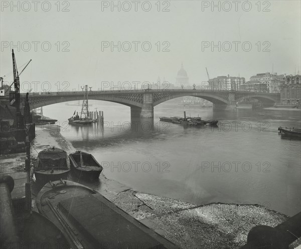Barges at Bankside, looking upstream towards Southwark Bridge, London, 1913. Artist: Unknown.