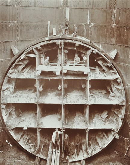 Men standing in the cutting shield, Rotherhithe Tunnel, Stepney, London, August 1907. Artist: Unknown.