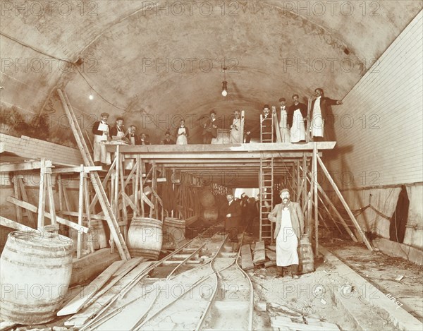 Workmen tiling the Rotherhithe Tunnel, London, December 1907. Artist: Unknown.