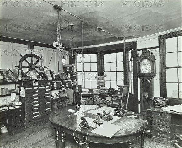 Interior of an office with a man on the telephone, Greenwich, London, November 1936. Artist: Unknown.