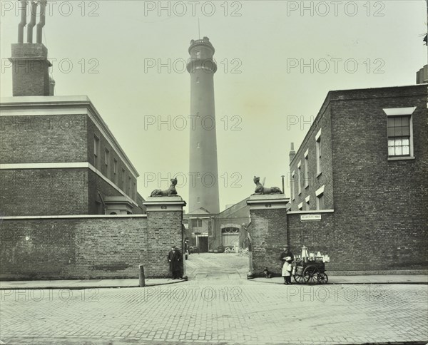 Shot Tower, gates with sphinxes, and milk cart, Belvedere Road, Lambeth, London, 1930. Artist: Unknown.