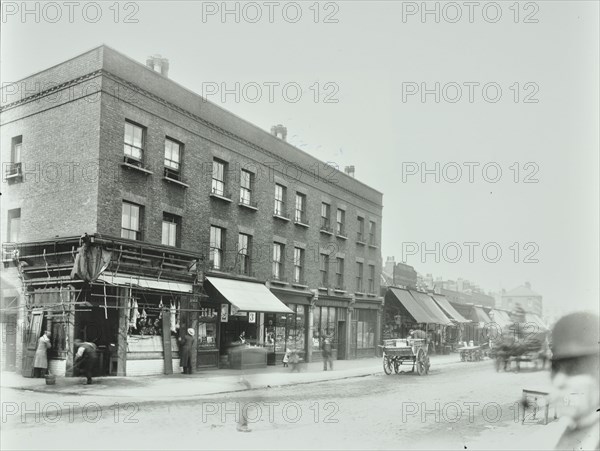 Butcher's and other shops on the Tower Bridge Road, Bermondsey, London, 1900. Artist: Unknown.