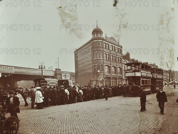 Queue of people at a bus stop in the Blackfriars Road, London, 1906. Artist: Unknown.