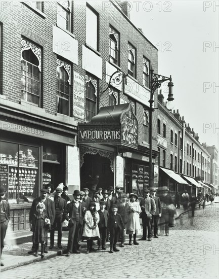 Crowd outside the Russian Vapour Baths, Brick Lane, Stepney, London, 1904. Artist: Unknown.