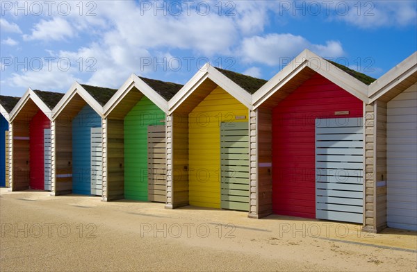 Row of different coloured beach huts, Blyth, Northumberland, 2010