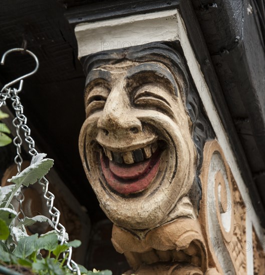 Painted corbel bracket on the Station public house, The Broadway, Stoneleigh, Ewell, Surrey, 2014